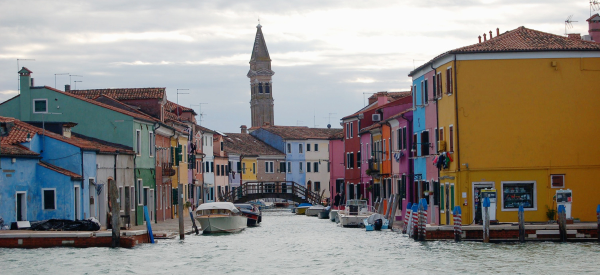 View of colorful island of Burano, Venice, Italy, where memoir editor LIsa Dale Norton lives for part of each year and works with memoir writers from around the world via the internet. She teaches, edits and coaches writers of books.